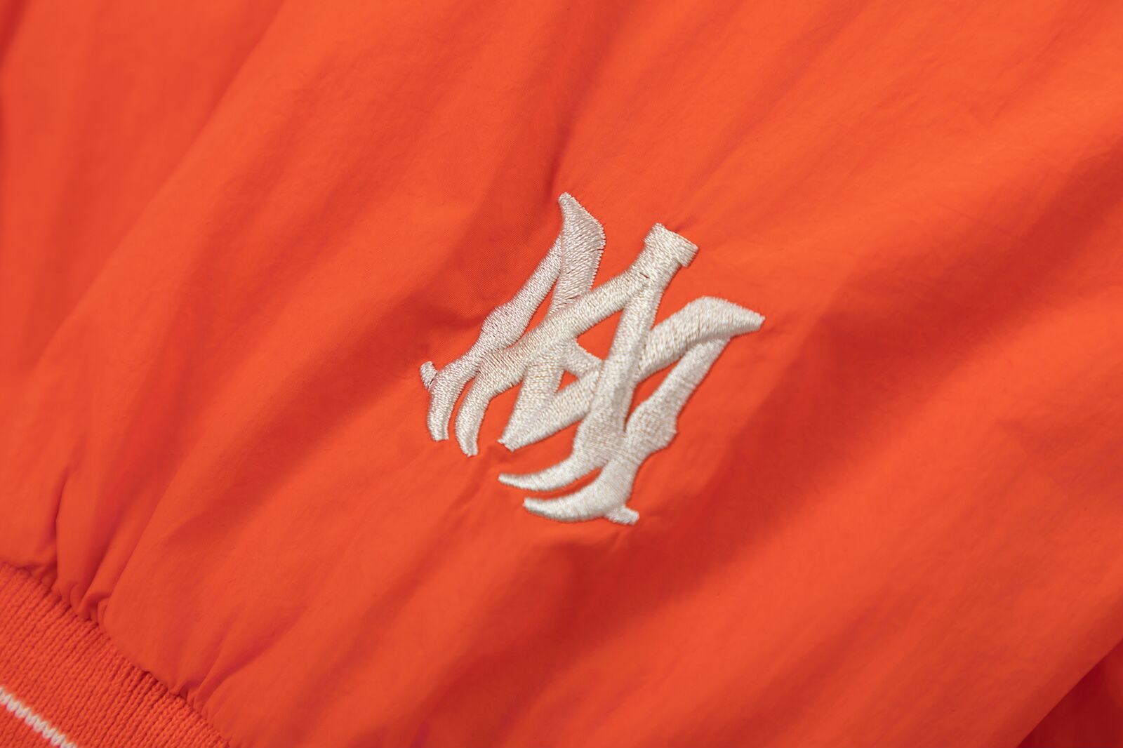 AMIRI Logo-Appliquéd Padded Shell Bomber Jacket – Orange & Black