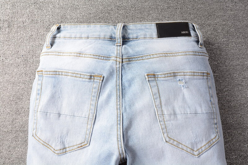 AMIRI Jeans #699 – Slim Fit Distressed Denim