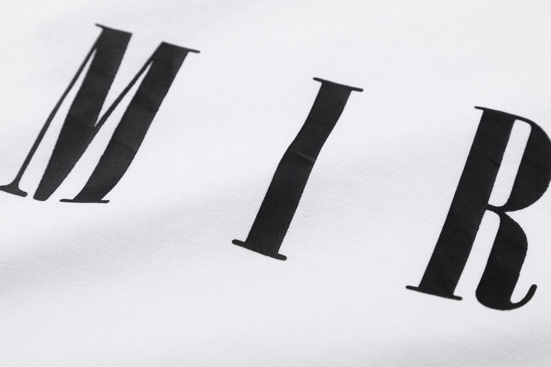 AMIRI Logo-Print Cotton Jersey T-Shirt | Black, White & Black Blue