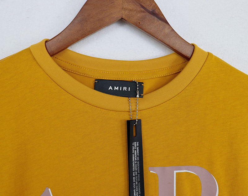 AMIRI Staggered Logo-Print Cotton Jersey T-Shirt | Black, Yellow & White