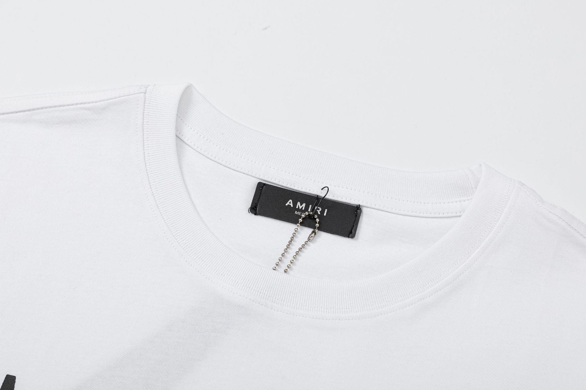 AMIRI Logo-Print Cotton Jersey T-Shirt | Black, White & Black Blue